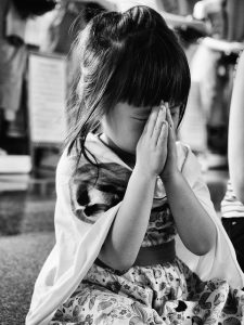 Small girl praying